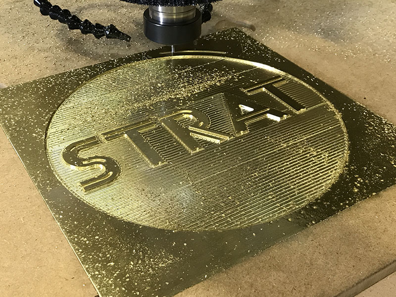 CNC router cutting brass signage